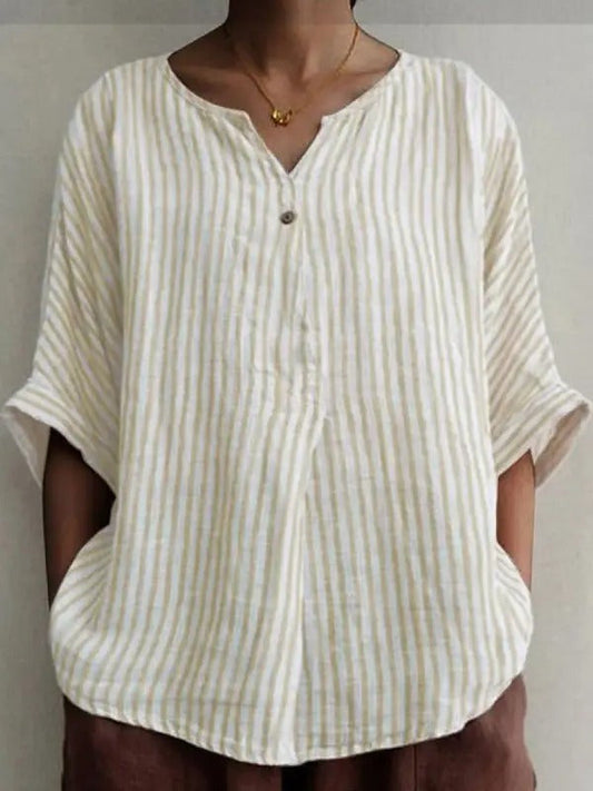 EP | Blouse blanche abricot avec col en V, motif à rayures et demi-manches